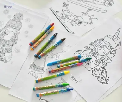 a group of colorful crayons on top of drawings at Hiona Apartment in Kopaonik