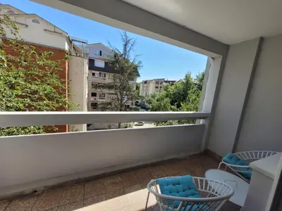 a balcony with a view of a city at Duka Apartment in Niš
