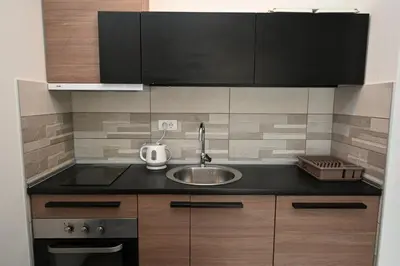 a kitchen with a sink and a counter top at Sneznik Palace in Vrnjačka Banja