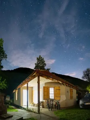 a house with two bikes parked in front of it at Vila Panic in Pirot