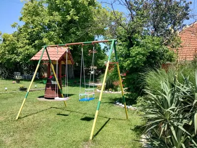 a swing set in a yard at Studio Ivana 2 in Soko Banja