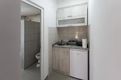 a small kitchen with a sink and a toilet at Rtanjska bajka in Boljevac