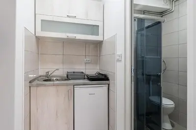 a small bathroom with a sink and a toilet at Rtanjska bajka in Boljevac