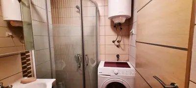 a small bathroom with a washing machine in it at Apartman Ana in Vrnjačka Banja