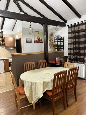 a dining room with a table and chairs at House Milovanovic in Soko Banja