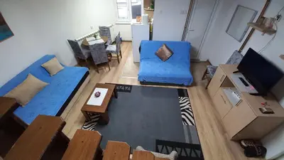 an overhead view of a living room with blue furniture at NOV-dve spavaće sobe in Kopaonik