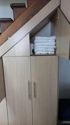 a wooden cabinet with towels on top of it at NOV-dve spavaće sobe in Kopaonik