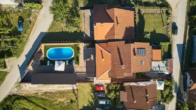 an overhead view of a house with a blue truck at AquaLux in Soko Banja