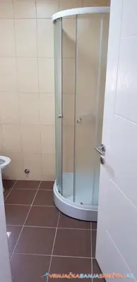 a shower with a glass door in a bathroom at VIP APARTMAN 2020 in Vrnjačka Banja