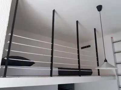 a mirror on a shelf in a room at Bianco nero appartamento in Niš