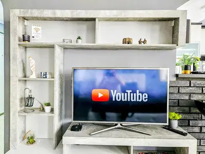 a television in a living room with the youtube logo on it at Savić Apartment CENTER - PARKING FREE in Niš