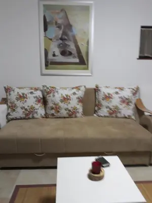 a living room with a couch and a coffee table at Vila Tiha noc in Kopaonik