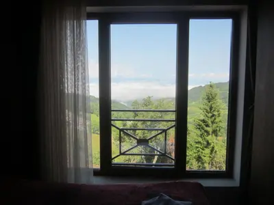 a window with a view of a mountain view at Milmari Pahulja in Kopaonik