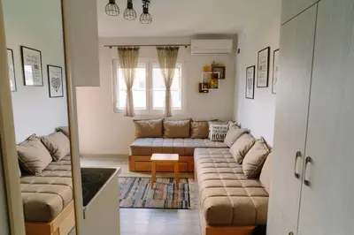 a living room with a couch and a table at Apartman Ristić in Vrnjačka Banja