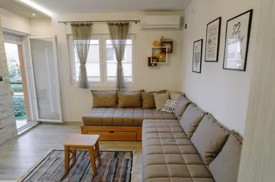 a living room with a couch and a table at Apartman Ristić in Vrnjačka Banja
