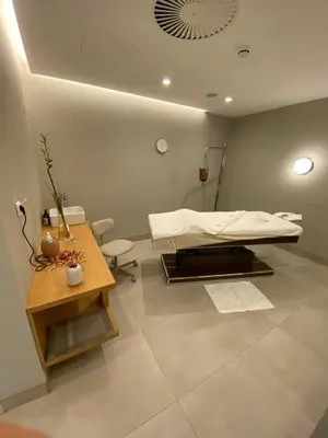 a hospital room with a bed and a table at Apartman Bozur in Vrnjačka Banja