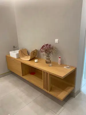 a bathroom with a counter with a sink and a mirror at Apartman Bozur in Vrnjačka Banja