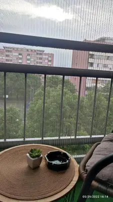 a table with two bowls of food on a balcony at Iva Lux apartman in Zaječar