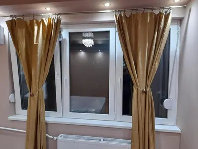 a window with curtains in a room at Iva Lux apartman in Zaječar