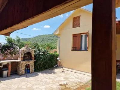 a view of a house from a patio at Ramonda Serbica- Peaceful Retreat in Sicevo Gorge in Niš
