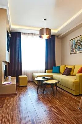 a living room with a couch and a table at Apartman IRINA 1243 in Kopaonik