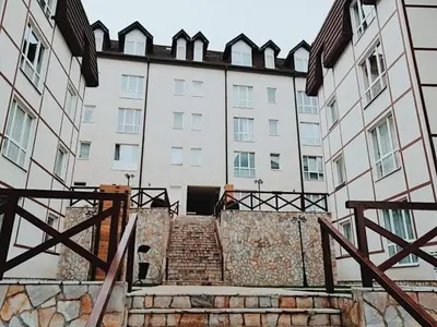 a set of stairs in front of a building at Apartman IRINA 1243 in Kopaonik