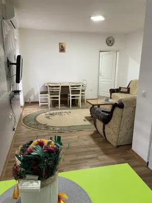 a living room with a couch and a table at SUNNY NEST in Vrnjačka Banja