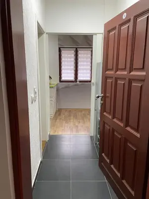 a hallway leading into a room with a door at SUNNY NEST in Vrnjačka Banja