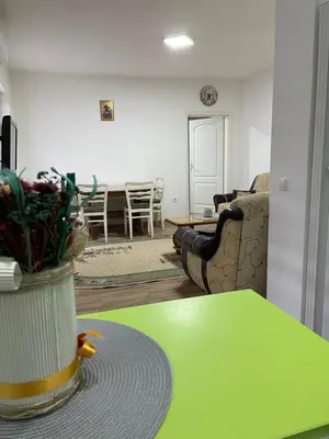 a living room with a couch and a table at SUNNY NEST in Vrnjačka Banja