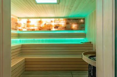 a sauna with a tub and a sink at Hotel Sunce in Soko Banja