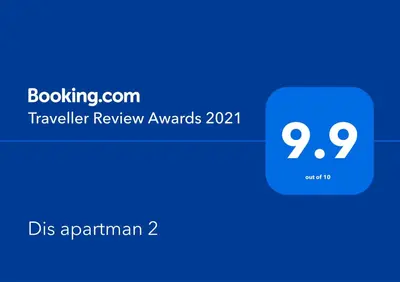 a screenshot of a phone with a blue box with the words travel review aw rewards at Dis apartman 2 in Kruševac