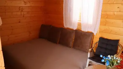 a small room with two chairs and a window at Vikendica Mijajlović 2 in Kuršumlija
