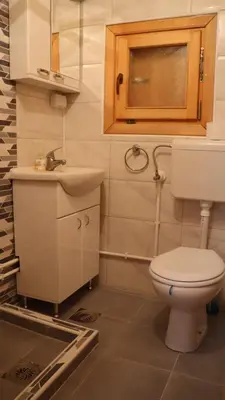 a bathroom with a toilet and a sink at Vikendica Mijajlović 2 in Kuršumlija