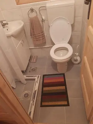 a small bathroom with a toilet and a sink at Vikendica Mijajlović 2 in Kuršumlija