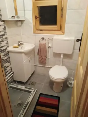 a small bathroom with a toilet and a sink at Vikendica Mijajlović 2 in Kuršumlija