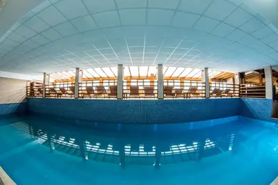 a large pool of water in a building at Milmari Resort M16 Markovic in Kopaonik