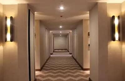 a corridor of a hotel with a long hallway at Viceroy Kopaonik Resort & Spa in Kopaonik