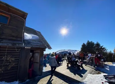 a group of people standing outside of a building at Megi apartman - Konaci Maglic in Kopaonik
