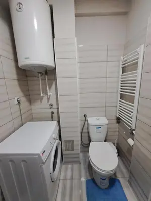 a small bathroom with a toilet and a sink at Apartman Vranje in Vranje