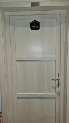 a white door with a sign on it at Apartman No1,Župa Wellness & Spa Kopaonik in Kopaonik