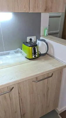 a toaster sitting on top of a kitchen counter at Apartman No1,Župa Wellness & Spa Kopaonik in Kopaonik