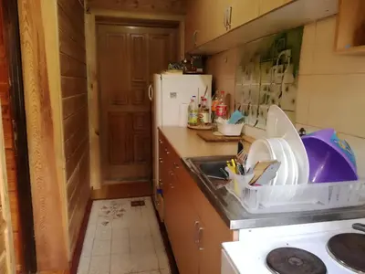 a kitchen with a sink and a counter top at Brvnara Aleksic in Kraljevo