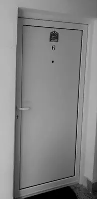 a white door with a sign on top of it at Mist8 in Soko Banja