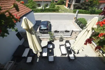 an overhead view of a patio with chairs and umbrellas at 