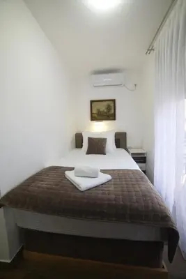 a bedroom with a bed with two towels on it at 