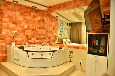 a room with a bath tub in the middle of a room at Design Apartment PREMIUM SPA LUX 4 STAR 