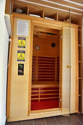 a sauna in a building with signs on the wall at Design Apartment PREMIUM SPA LUX 4 STAR 