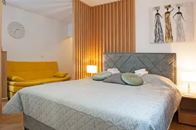 a bedroom with a bed with two pillows on it at TeonaLux Kraljevi Cardaci 5a/22 in Kopaonik