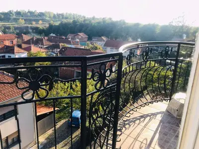 a balcony with a view of a city at Bubinga in Kruševac