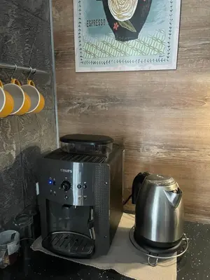 a coffee maker and a coffee pot on a counter at Bubinga in Kruševac
